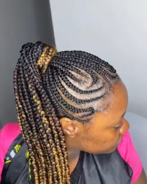 Side view of Kate's high ponytail, black and honey-blonde braids falling past her shoulder