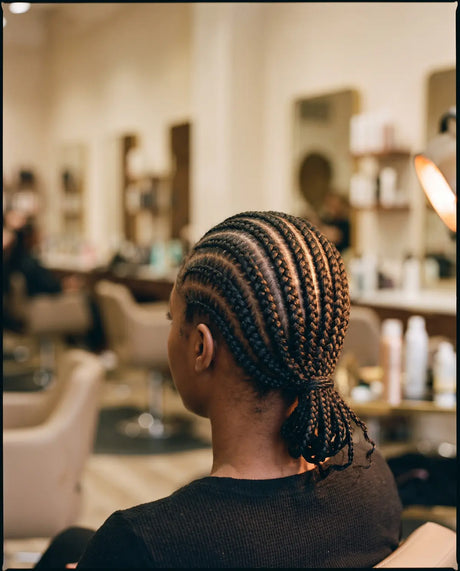 Neat feed-in braids finished at the salon