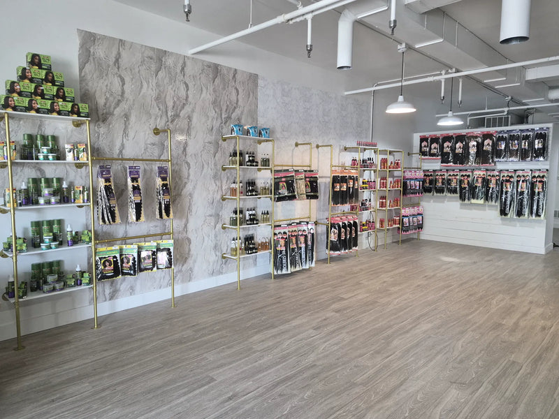 Inside the LovelyHair beauty supply in West Des Moines: gold shelving stocked with hair care, braiding hair and wig products