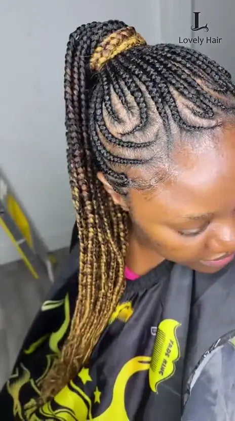 Video: a client turns her head to show curved feed-in cornrows swept into a high ponytail, braided at Lovely Hair in West Des Moines