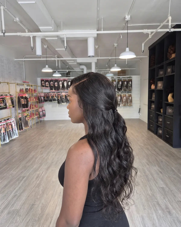 Example of a long body-wave sew-in weave with a natural leave-out, Lovely Hair, West Des Moines